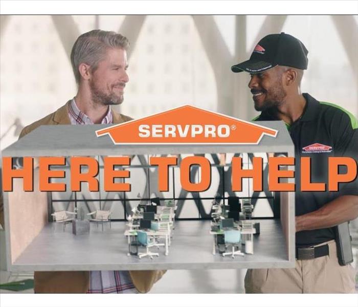 Construction - image of SERVPRO employee and customer smiling